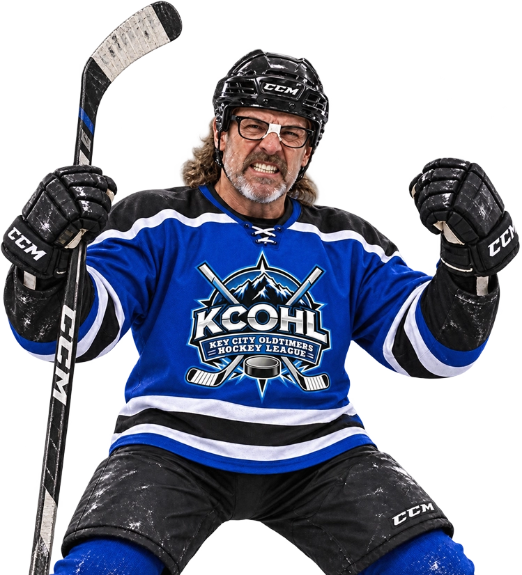 A KCOHL player in a blue jersey celebrating, stick and fist raised